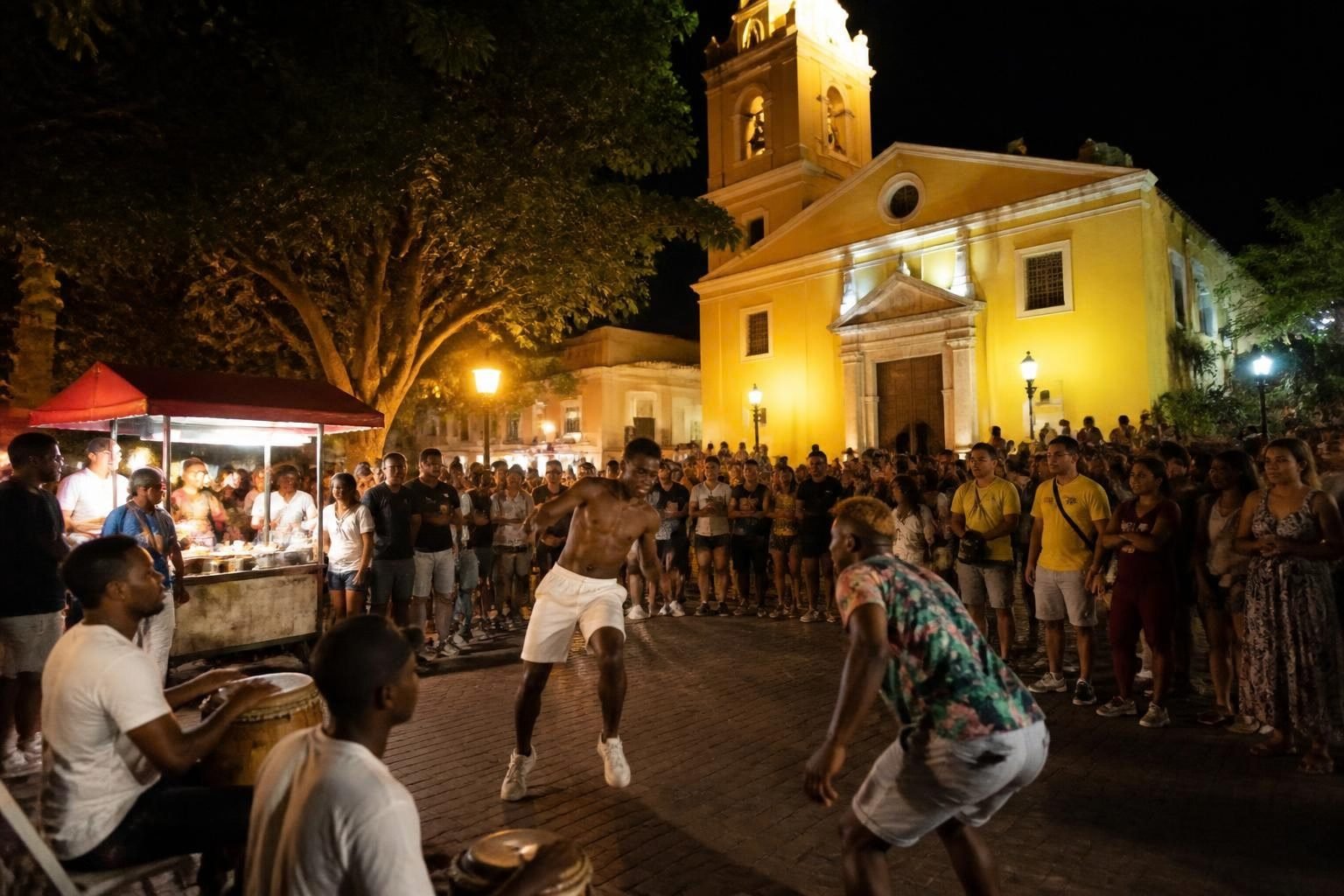 Street dancers performing in Plaza de la Trinidad at night